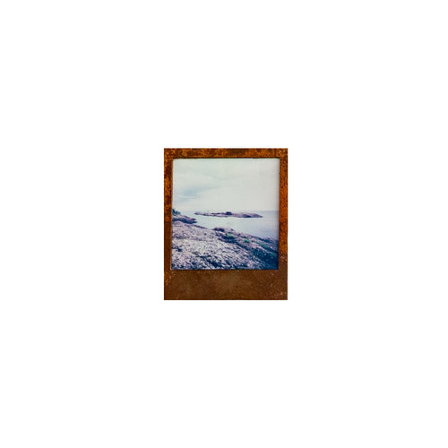 Steel Framed insant film photograph of a coastal scene in the keeweenaw peninsula  on a white background